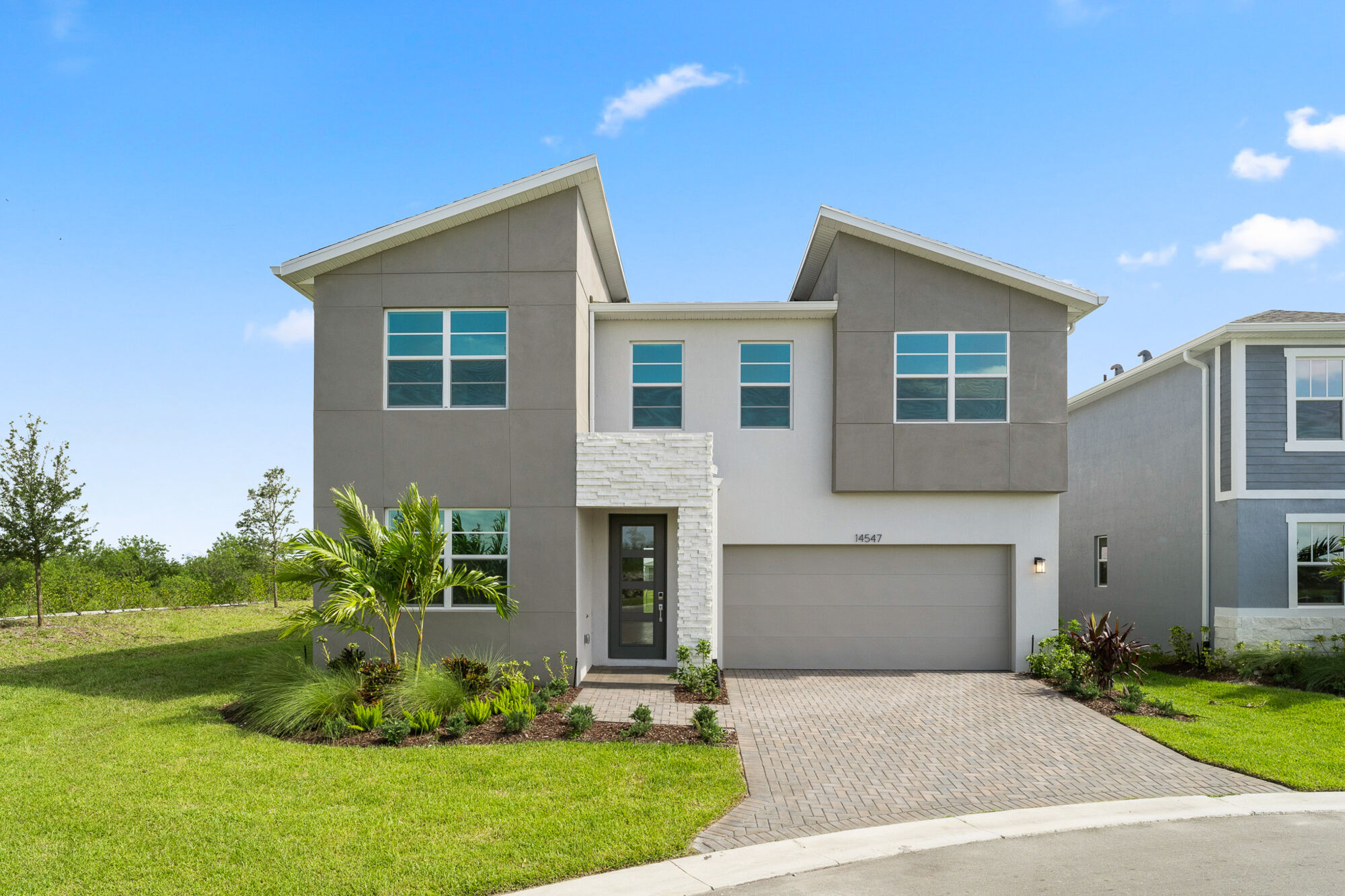  Elevation Front with garage, window and exterior stone