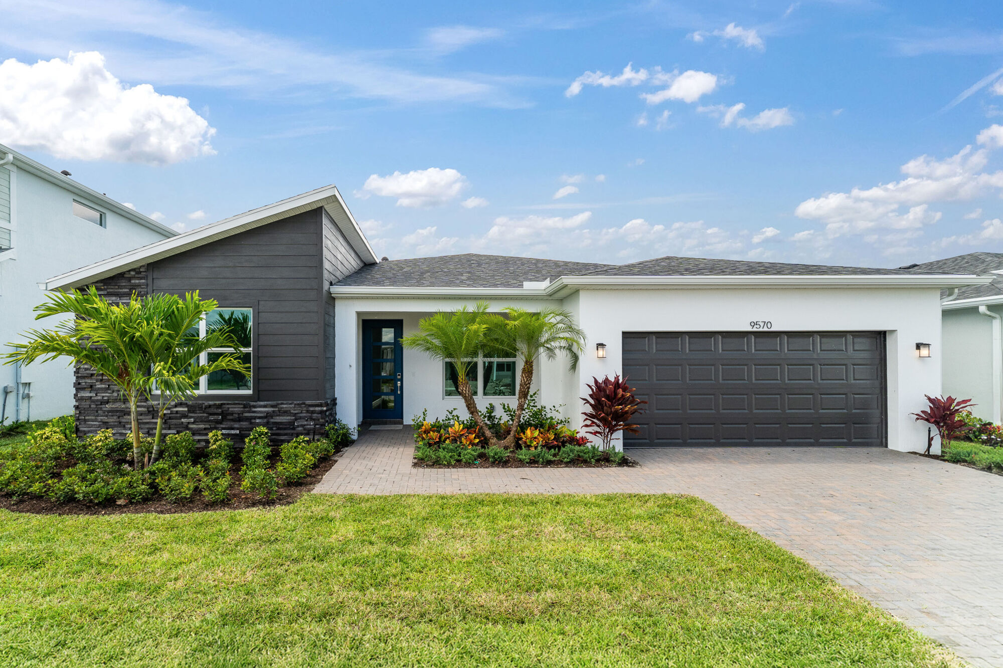  Elevation Front with garage, door, exterior clapboard and window