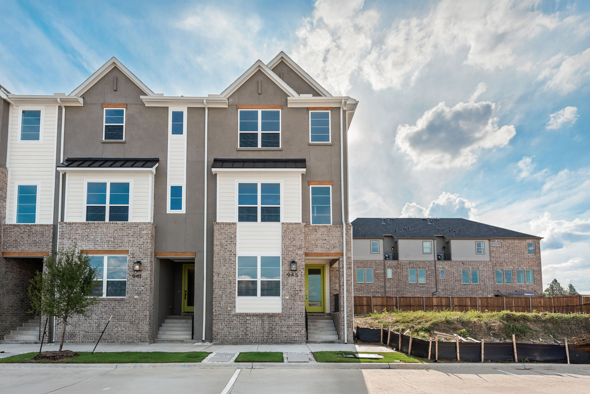 Town Homes with window, exterior brick and exterior clapboard