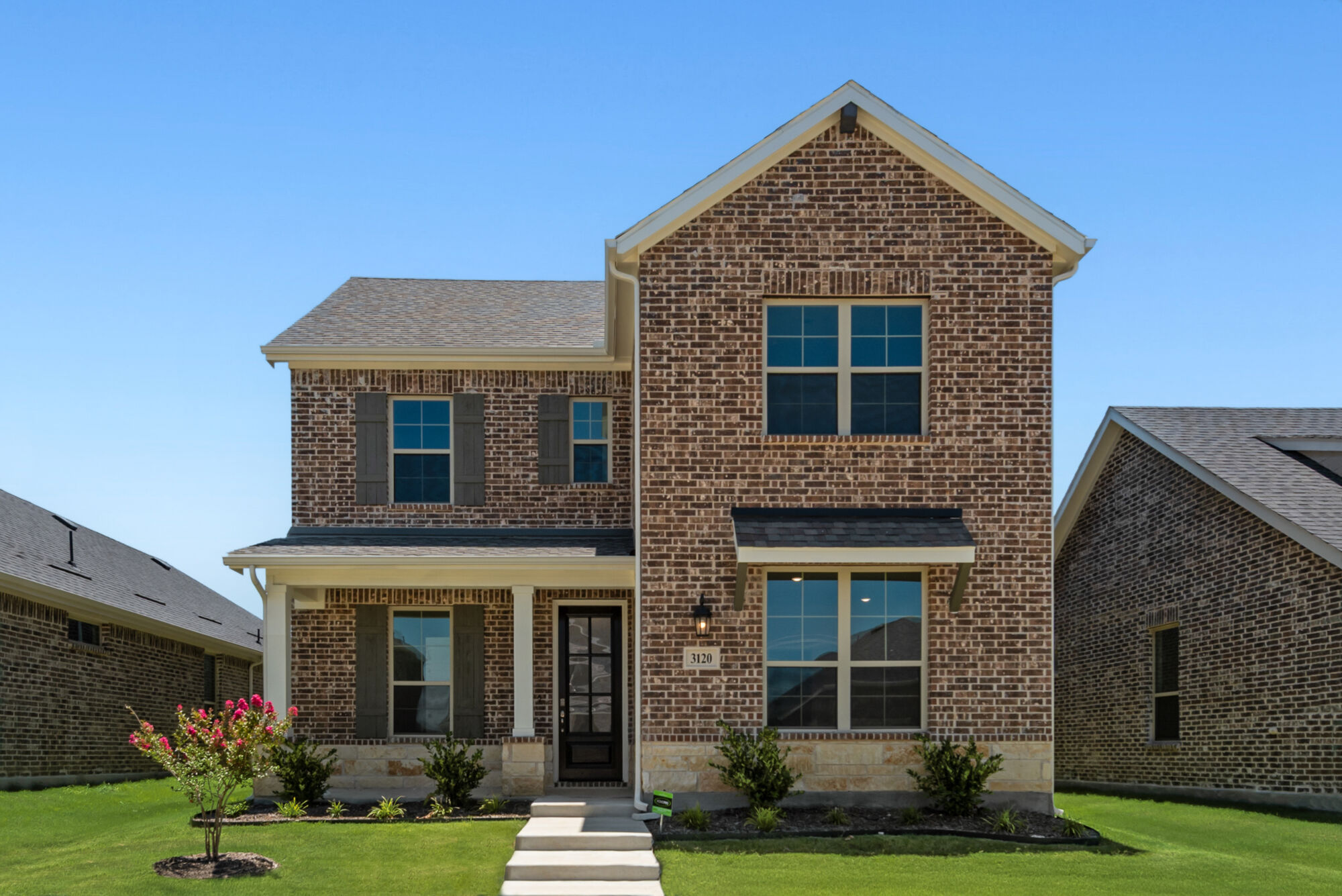 Elevation Front with window, door and exterior brick
