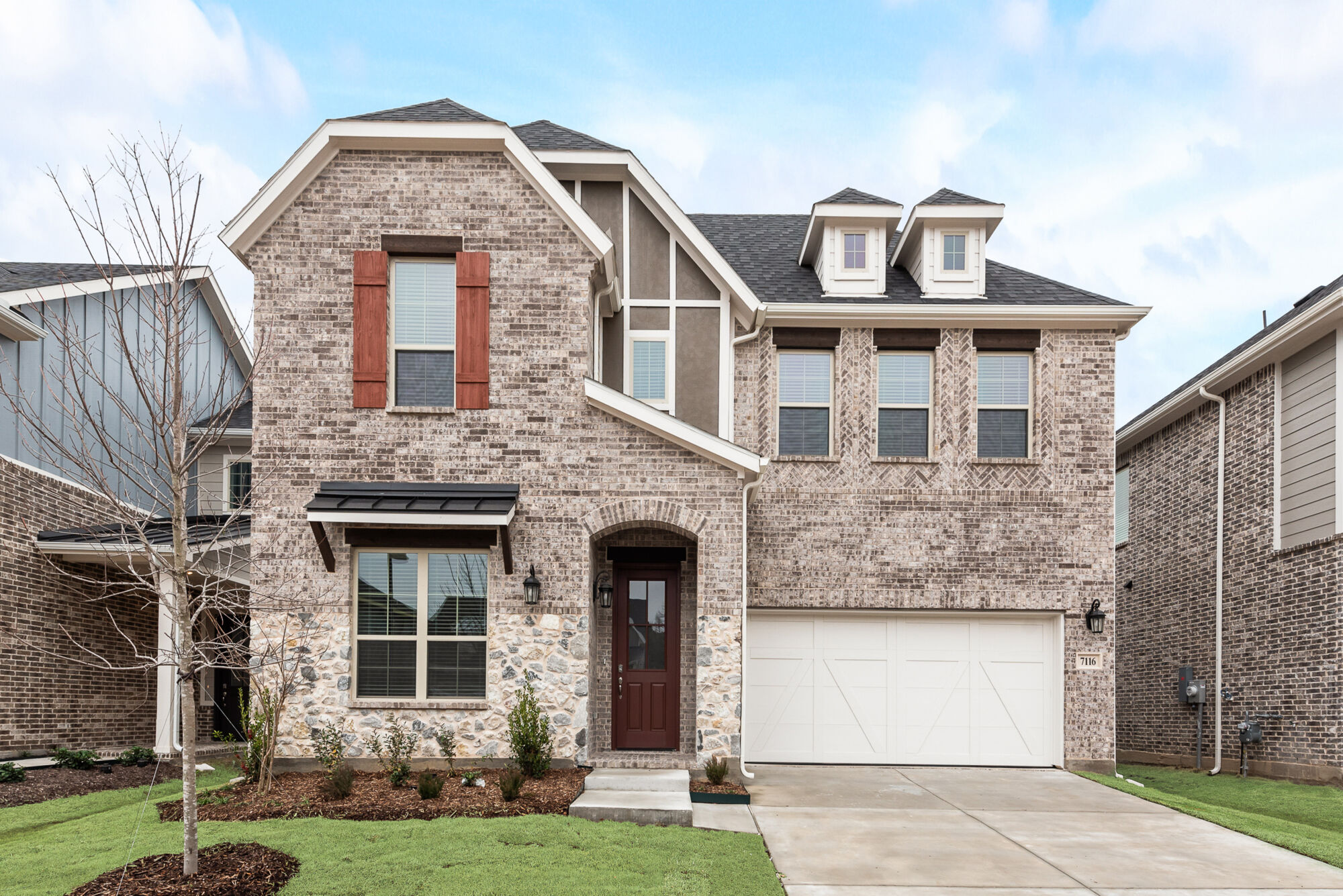 Elevation Front with window, garage, door, exterior brick and exterior stone