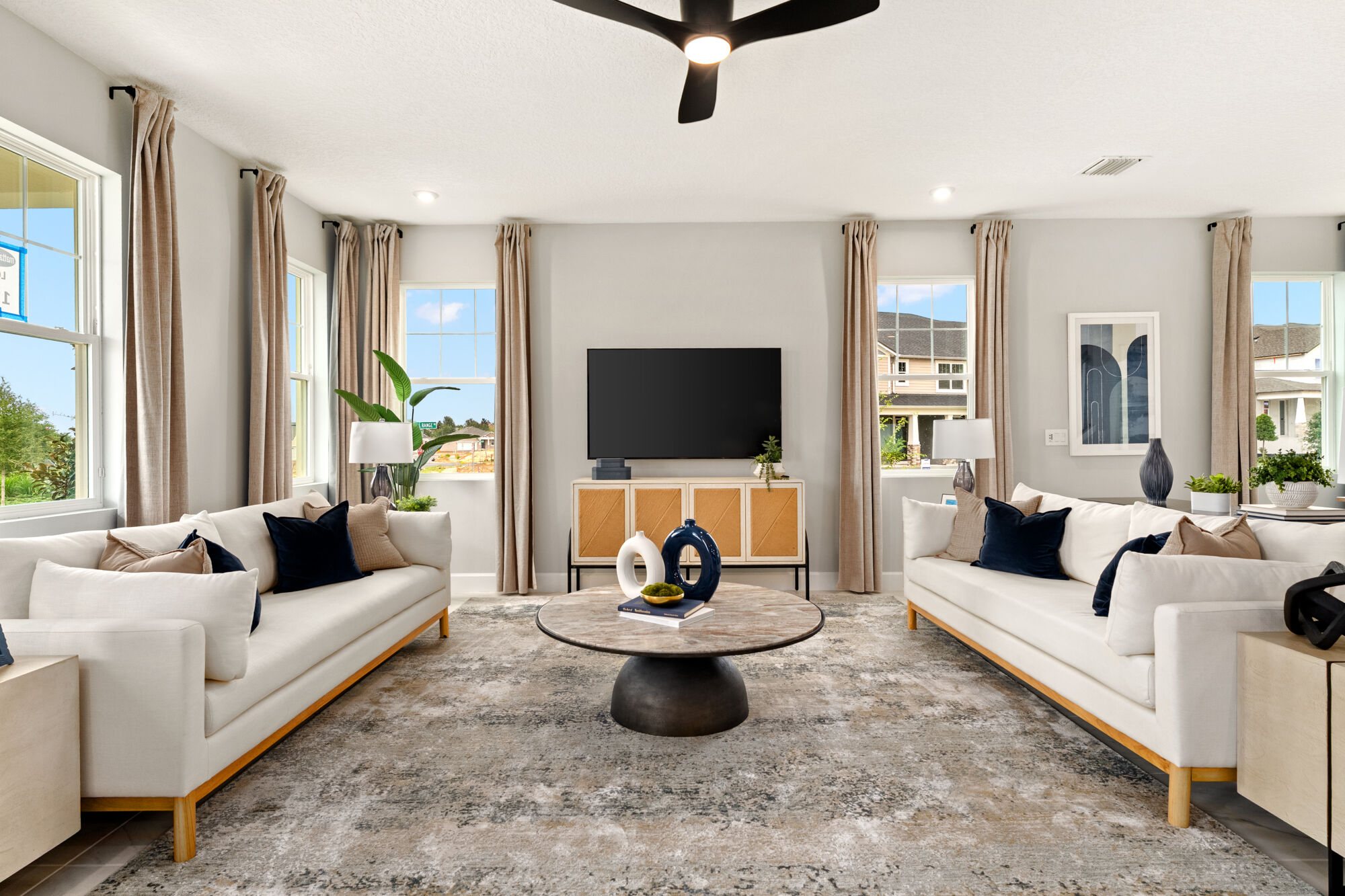  Greatroom with window, curtains, painting, rug and carpet