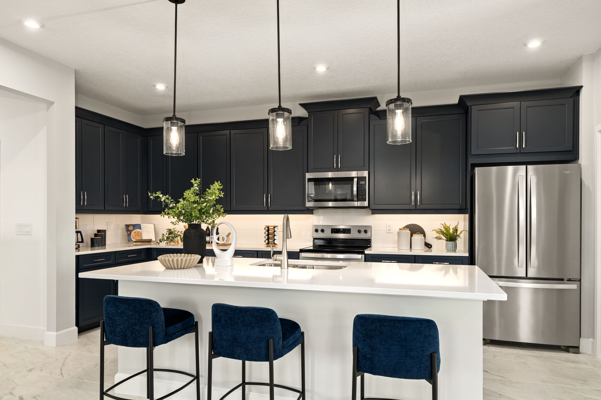 Single-Wall Kitchen with refrigerator, pendant light, range and tile flooring