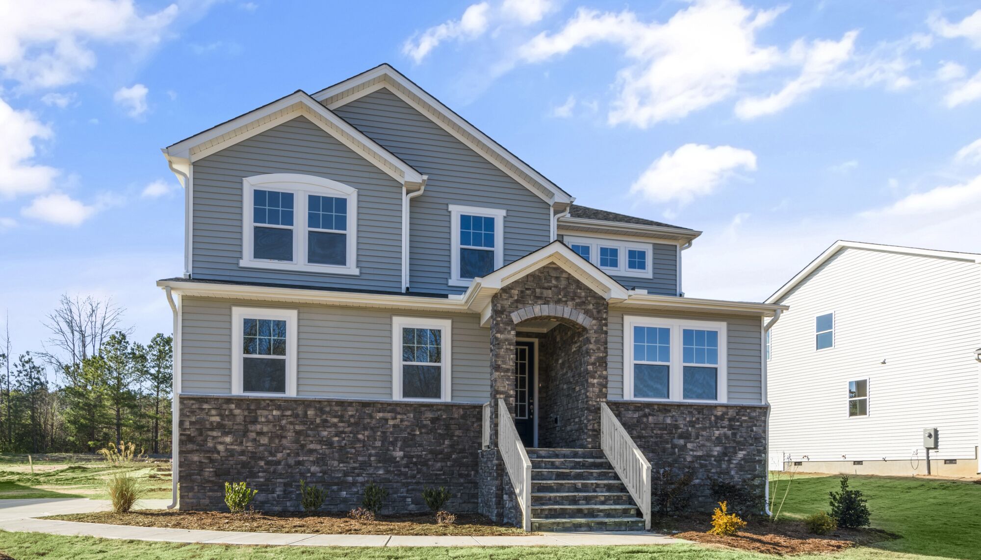 Elevation of a single-family home, exterior stone and siding