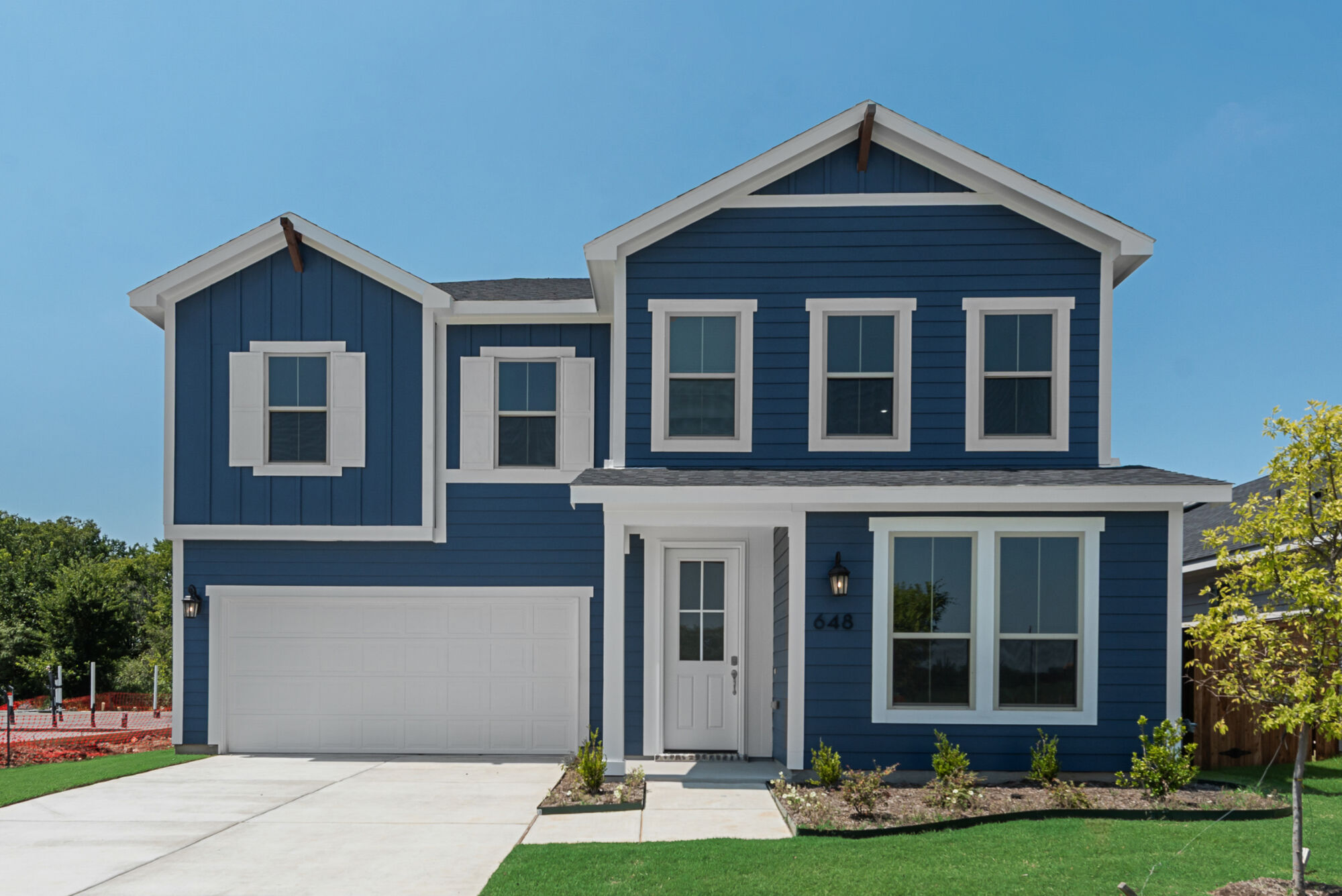 Elevation Front with window, garage, door and exterior clapboard