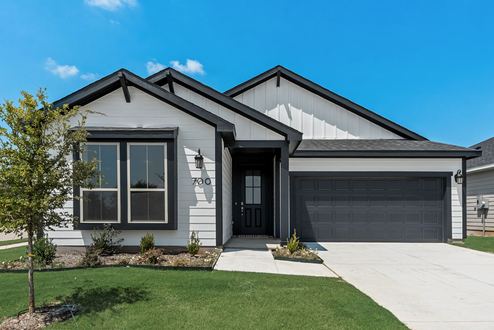 Elevation Front with window, garage and door
