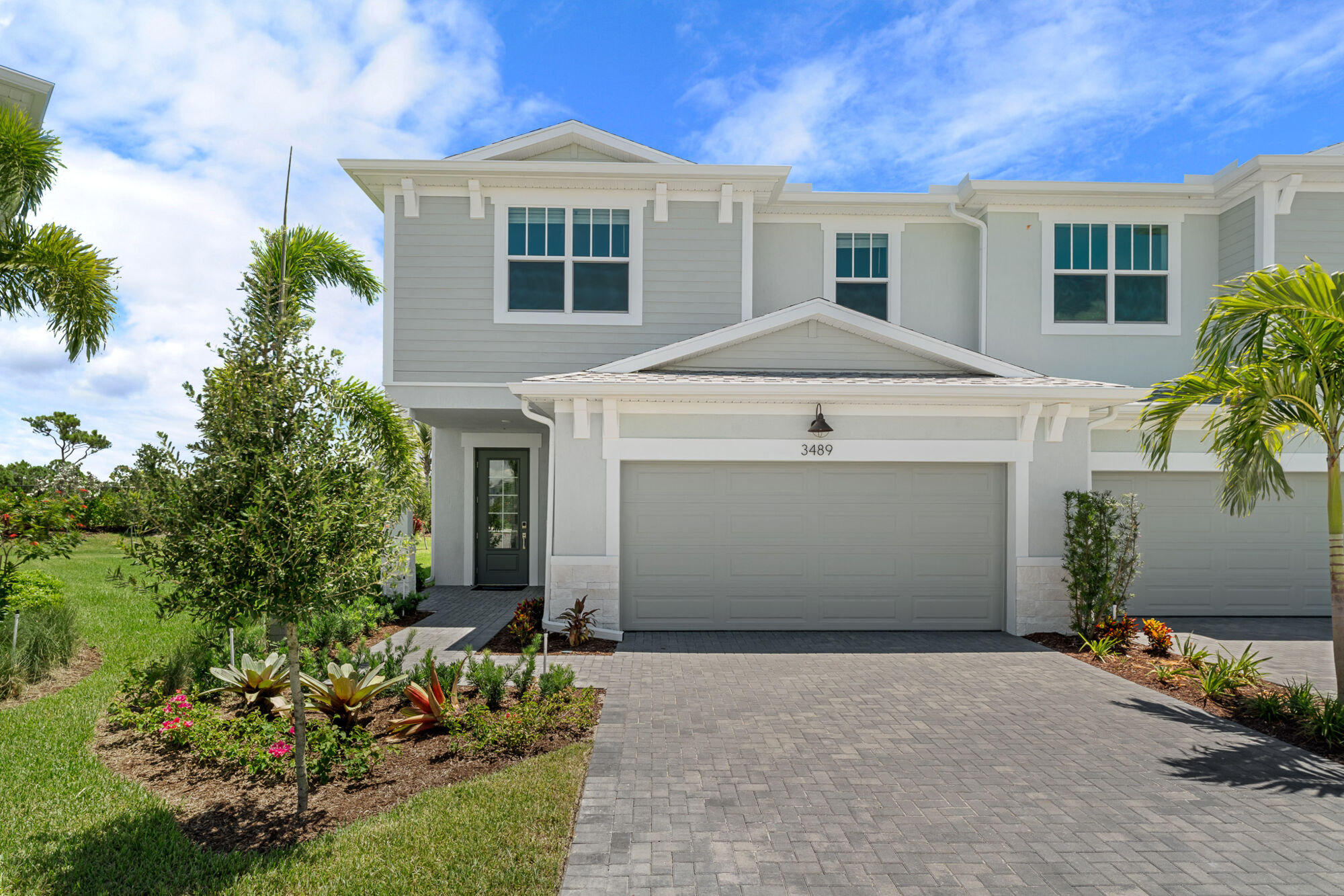  Elevation Front with garage, window, door and exterior clapboard