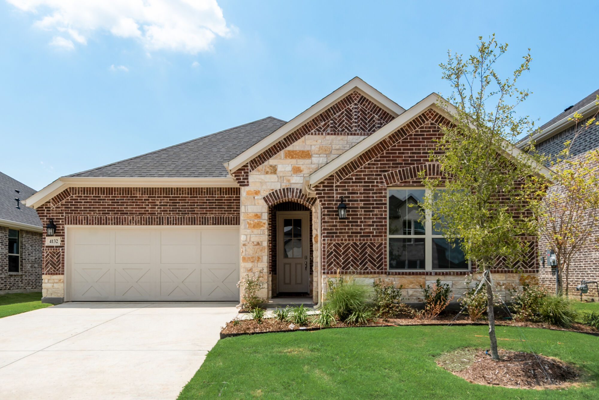 Elevation Front with garage, window, door, exterior brick and exterior stone