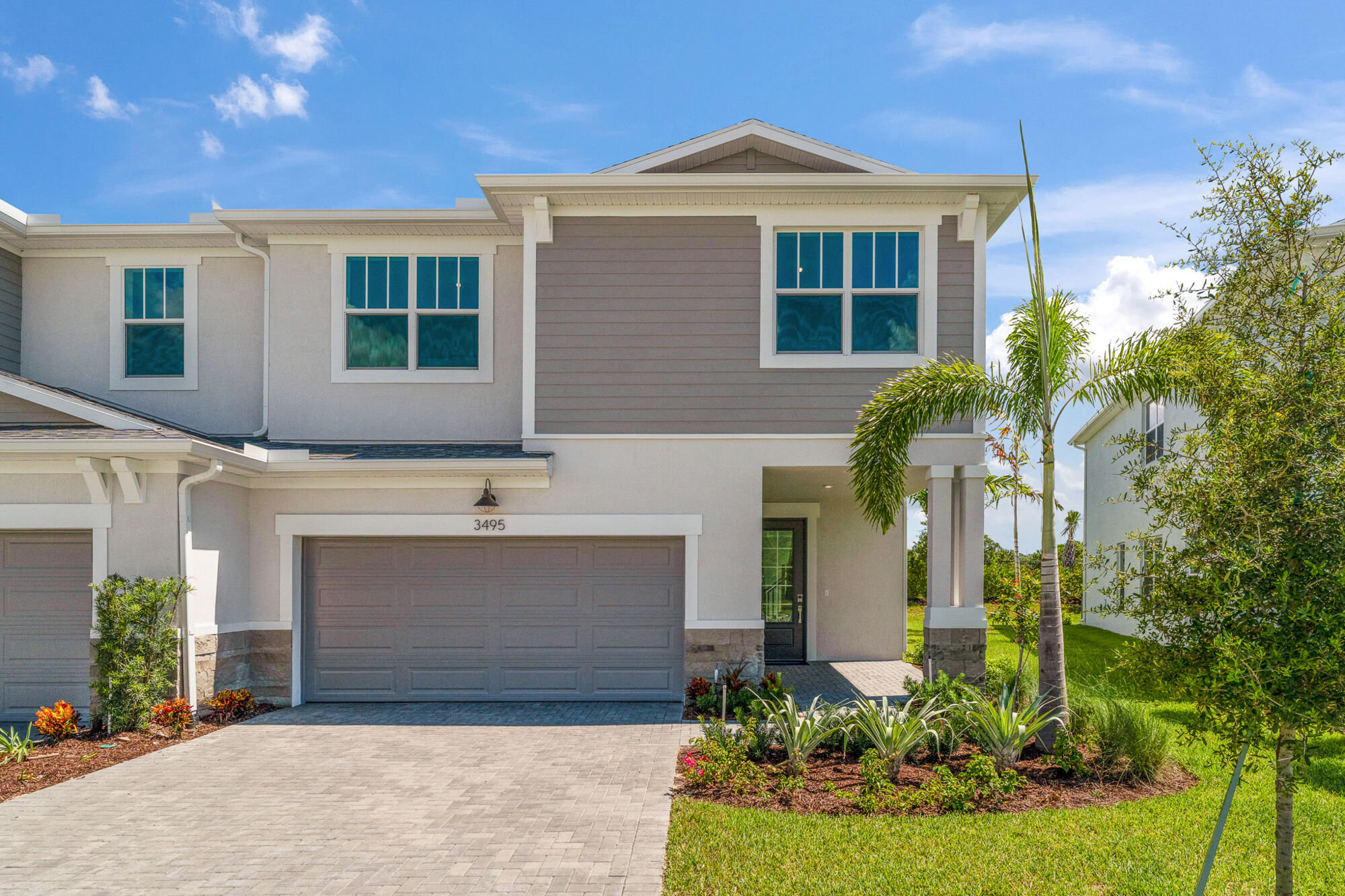  Town Homes with garage, window, exterior clapboard and exterior stone
