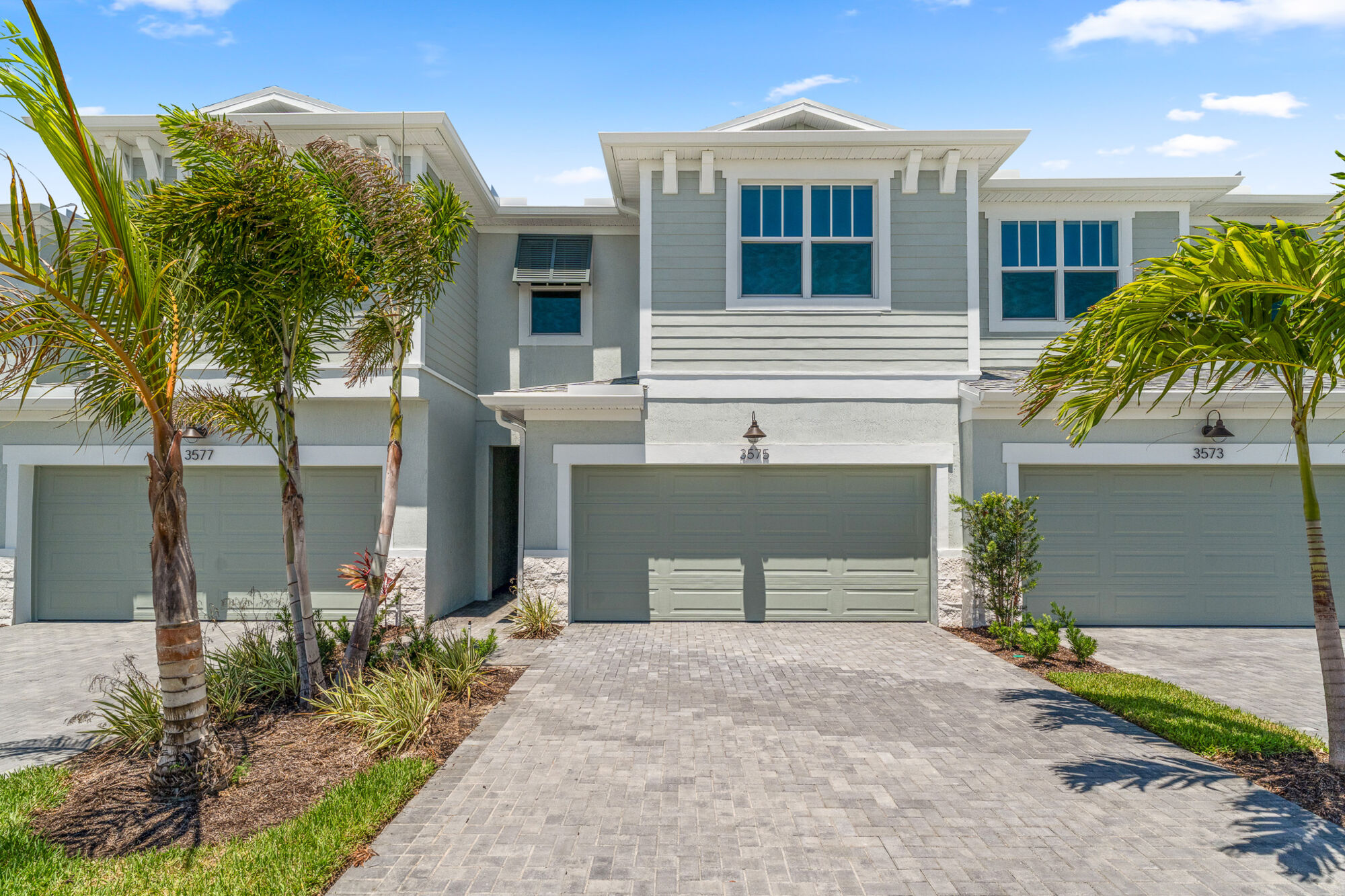  Elevation Front with garage, window, exterior stone and exterior clapboard