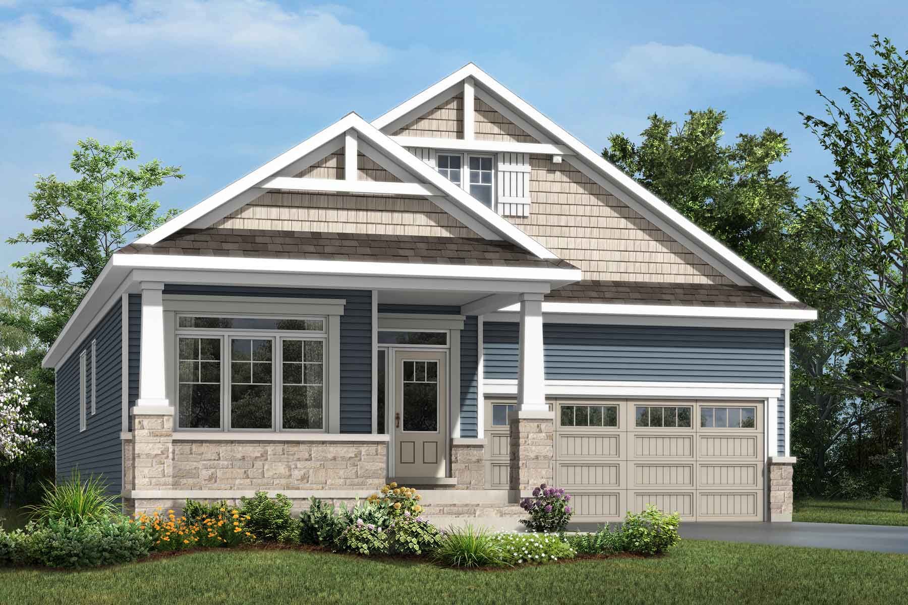 A Craftsman style detached home with a double car garage.
