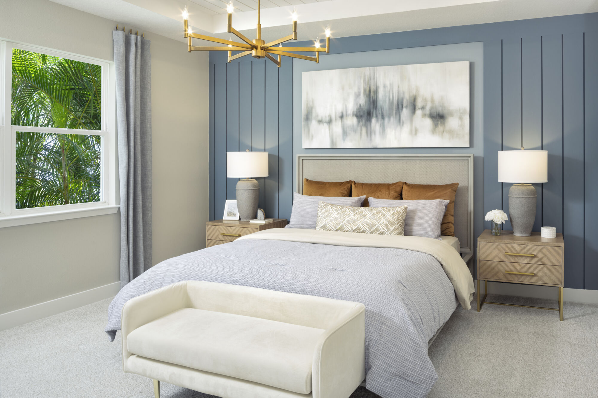 Owners Suite Bedroom with painting, window, pendant light, curtains and carpet