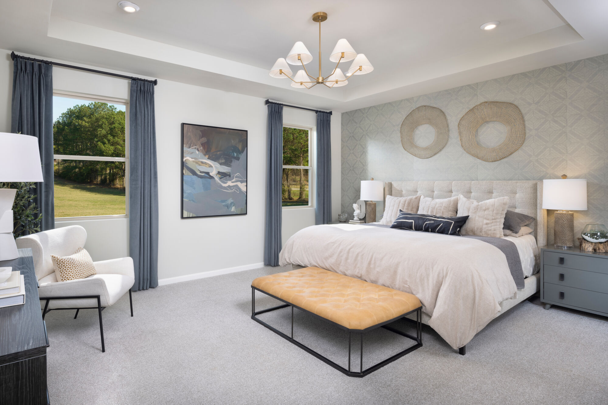 Owners Suite Bedroom with window, painting, curtains, pendant light and carpet