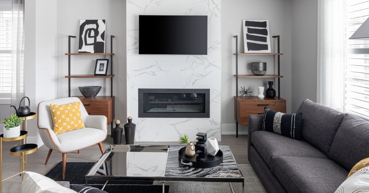Greatroom with fireplace, painting, window and curtains 