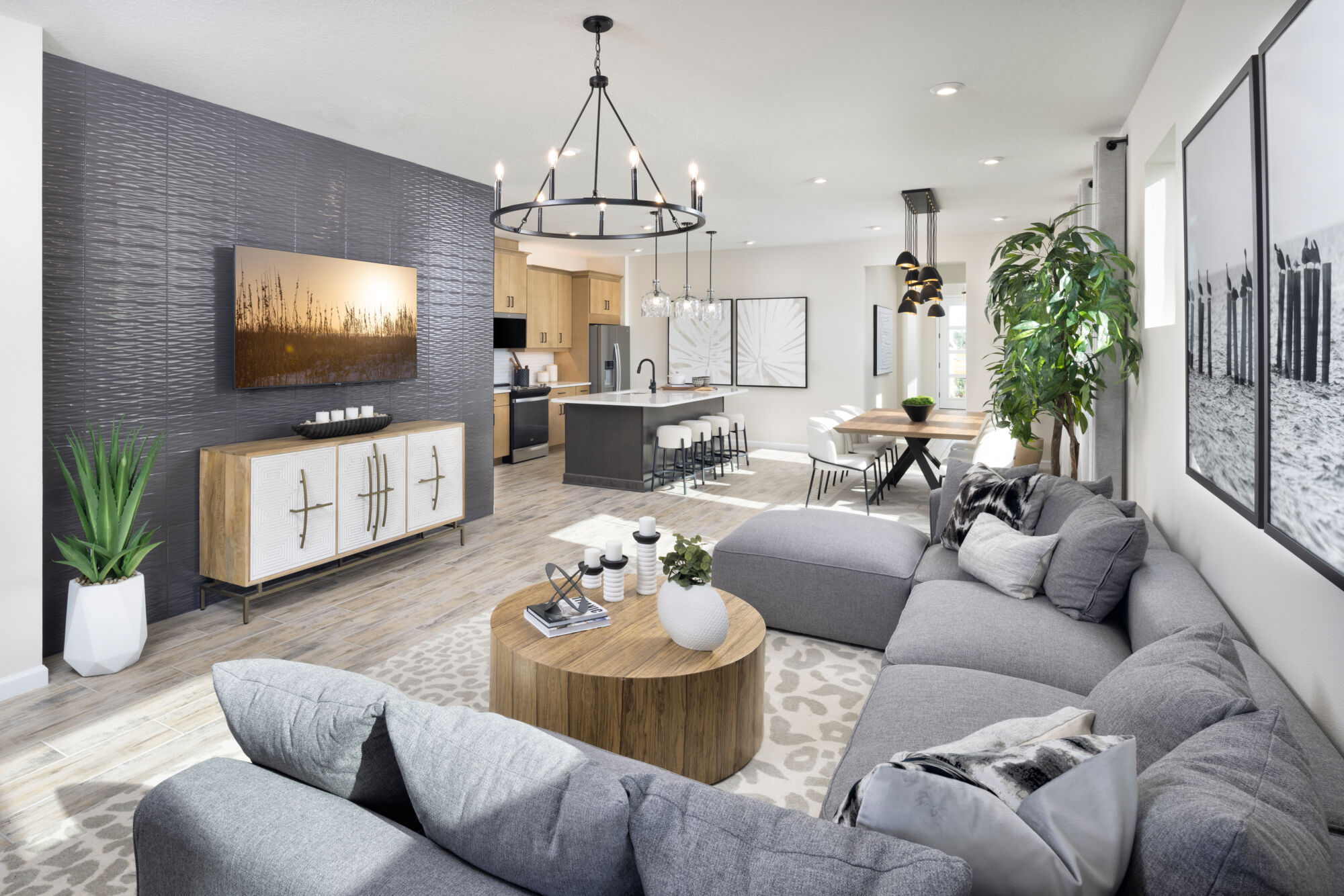  Greatroom with painting, pendant light, window and wood flooring