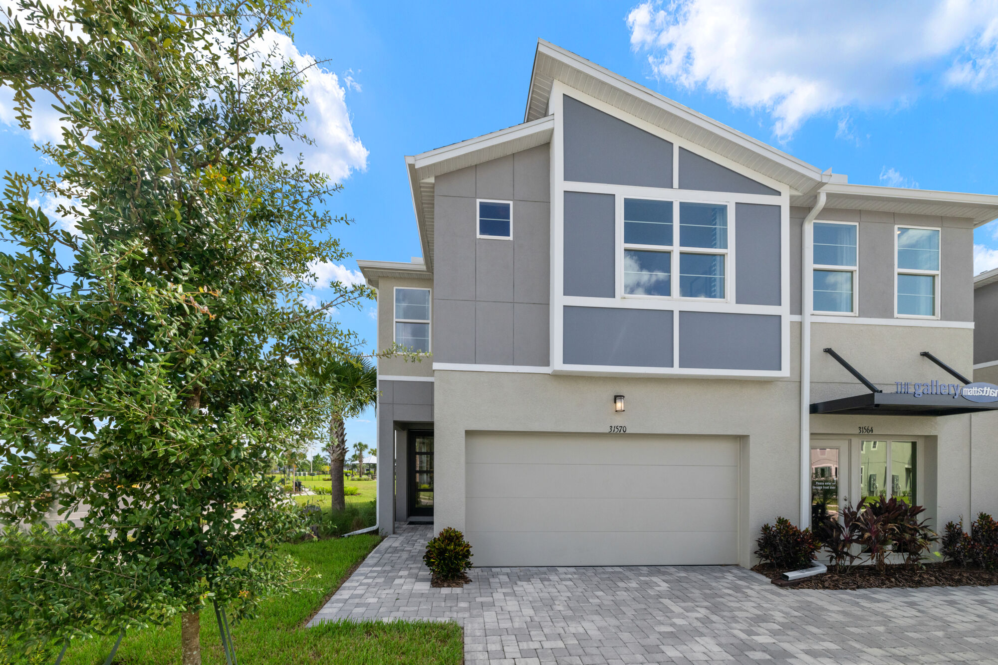 town home, open concept, gray cabinets, quartz countertops, luxury vinyl plank flooring, loft, 3 bedrooms. 2 bathrooms, powder room, breakfast bar, island, walk-in closet, 