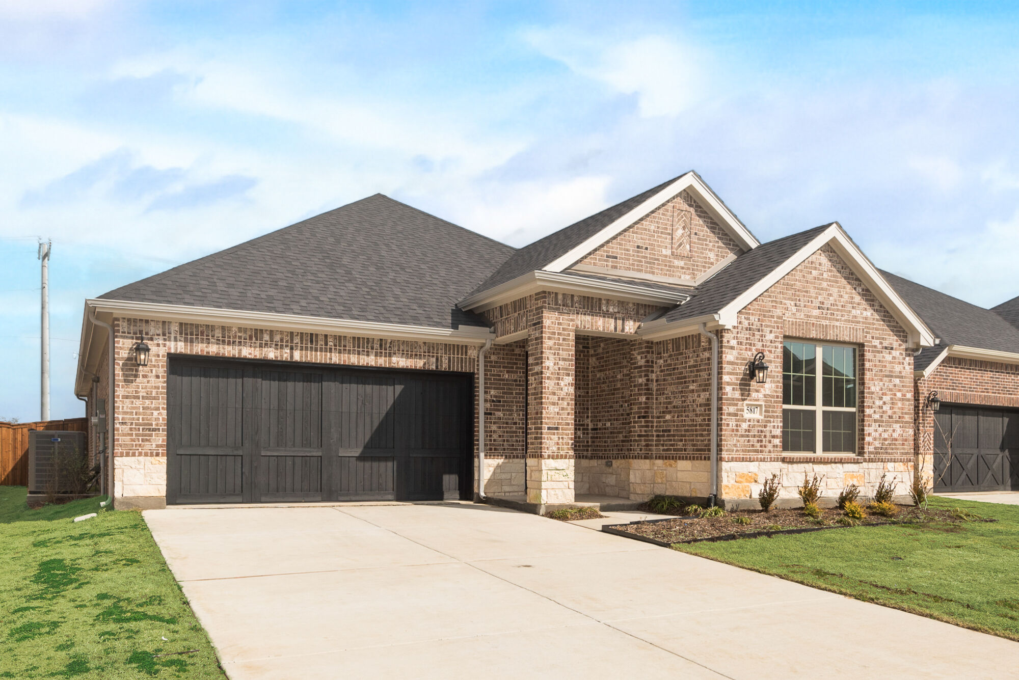 Elevation Front with garage, window and exterior brick